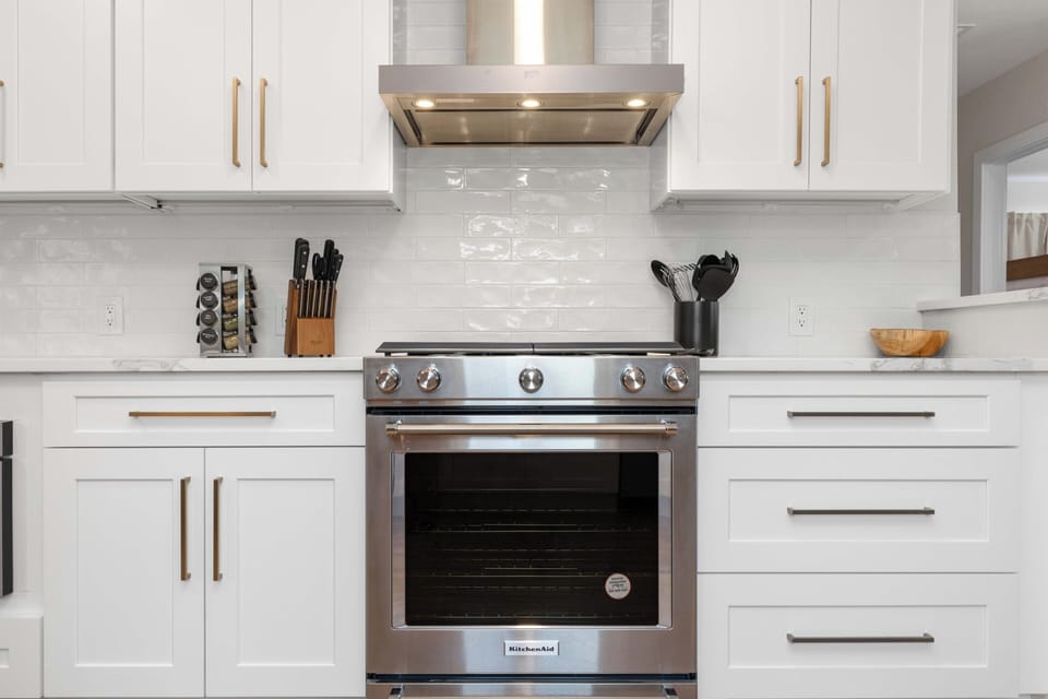 Fully equipped modern kitchen with stainless appliances for home cooking