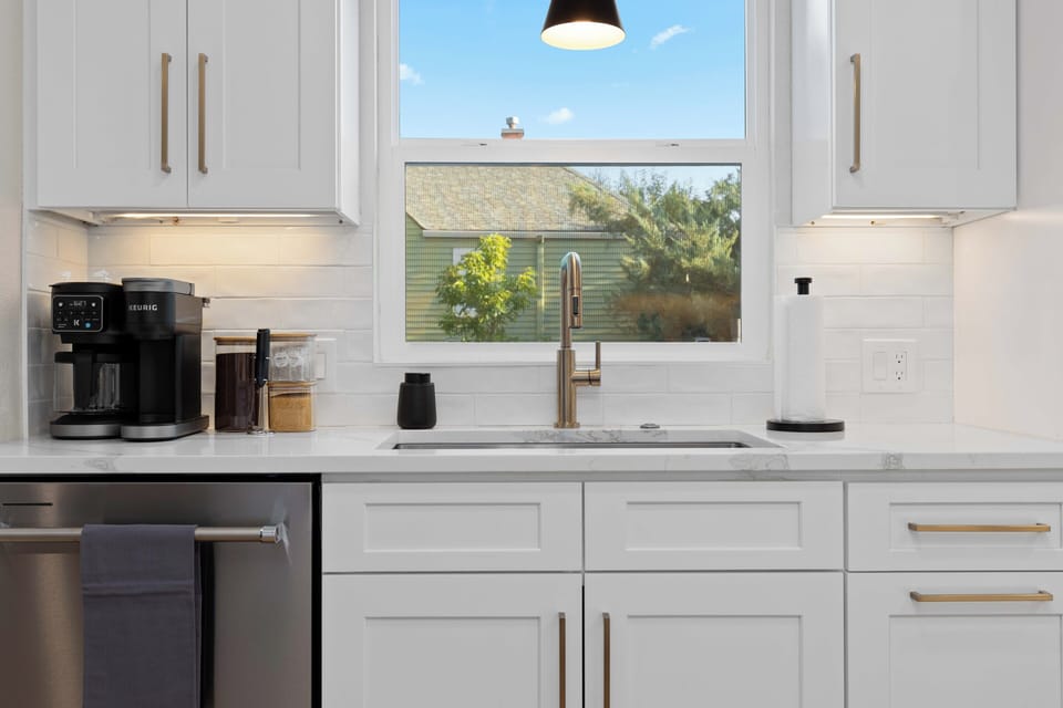 Fully stocked modern kitchen with ample counter space for group meals