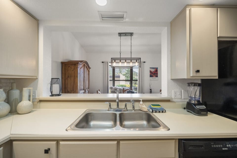 Kitchen sink with view of the living room