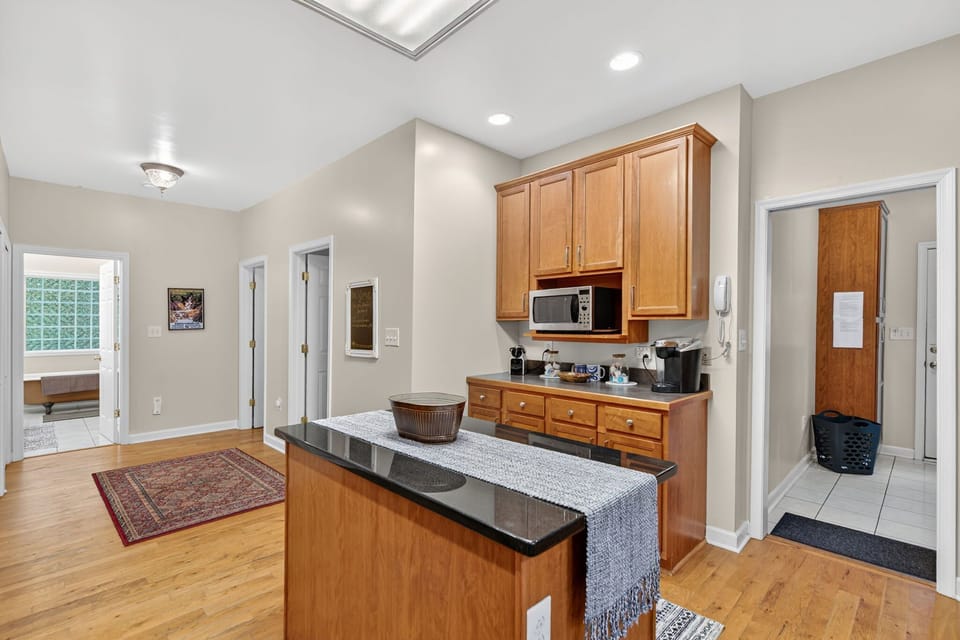 Fully stocked kitchen with stainless steel appliances, Nespresso, Keurig and drip coffee maker, large island, and ample prep space—ideal for the chef in your group