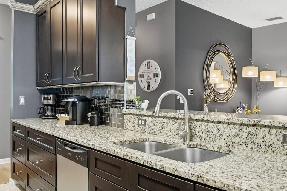 Modern kitchen with sleek appliances, Keurig & drip coffee maker—ideal for cooking, coffee, and entertaining.