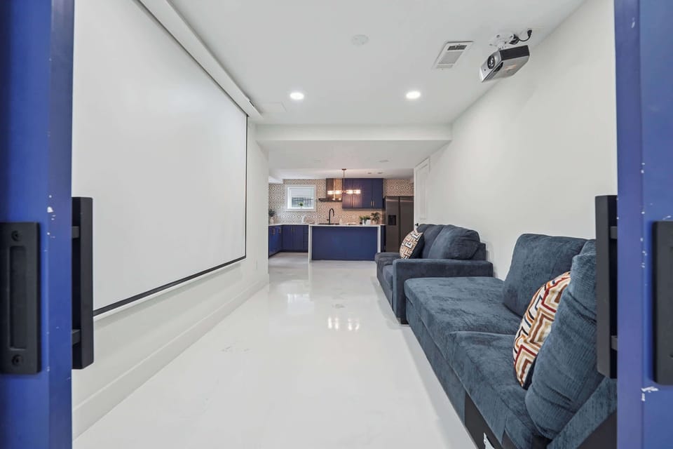 Theatre area in basement.  Just hook up your Laptop and watch a movie!