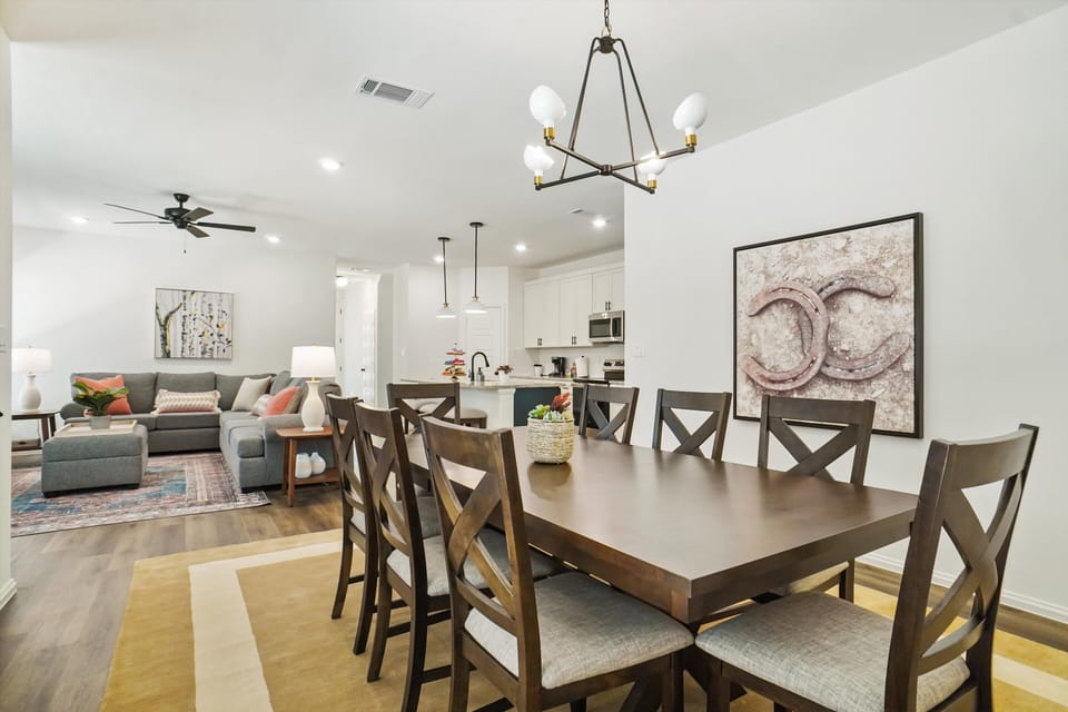Dining Room – Open Floor Plan with Kitchen and Living Room Views
