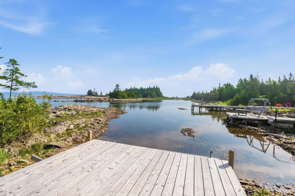 Step onto the dock and enjoy peaceful water views and easy lake access. Ideal for swimming, paddling, and relaxed waterfront travel.