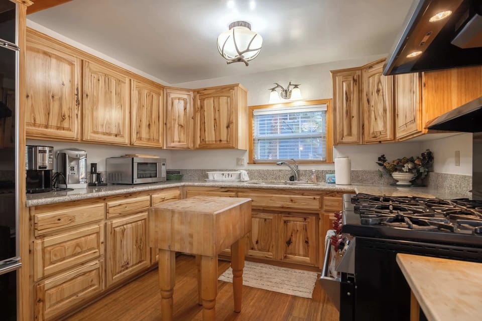 Fully stocked kitchen. Gas Stove, Refrigerator with Ice Maker, Microwave, Coffeemaker. All kitchenware included.