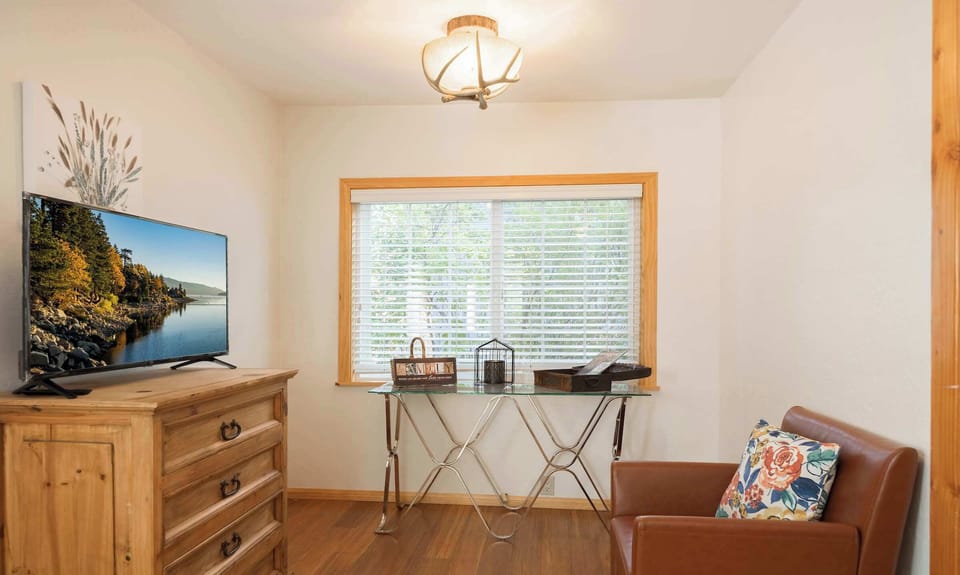 Sitting Area in Primary Bedroom with Smart TV.