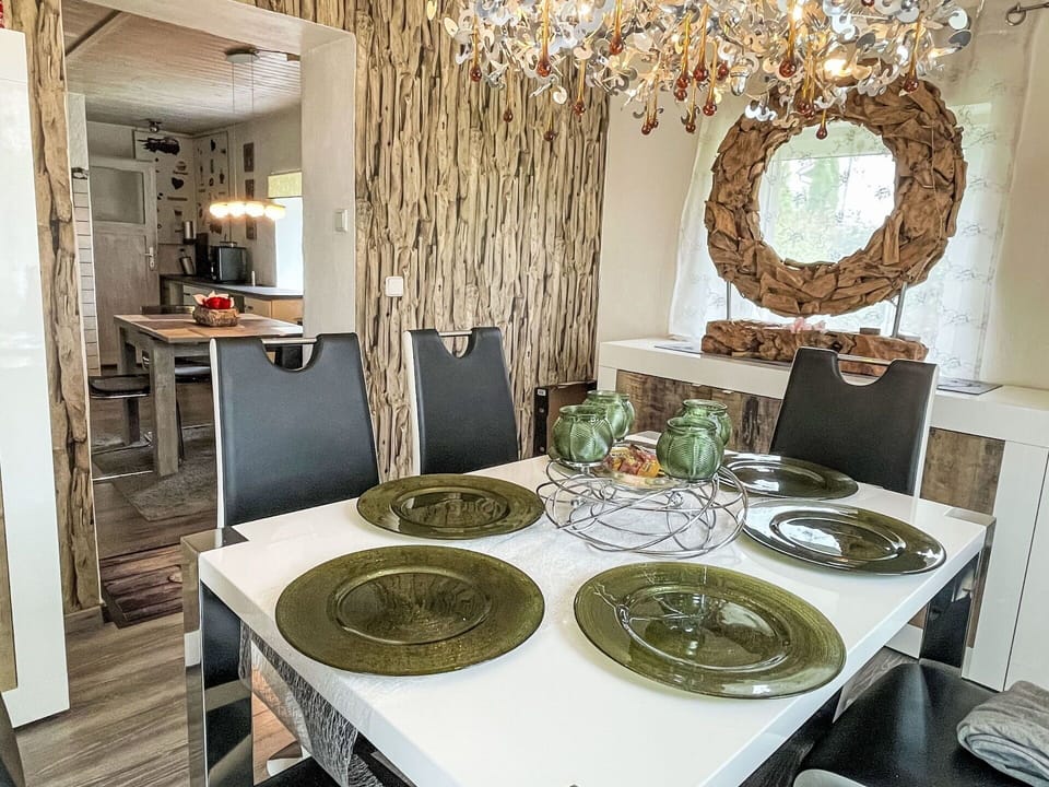 Furniture, Interior Design, Wall, Wood, Flooring, Ceiling, Light Fixture, Chair, Table, Chandelier