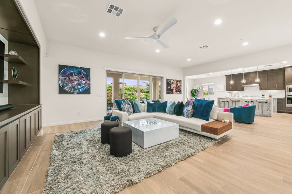 Bright open-concept living space with stunning golf course views and room for everyone.
