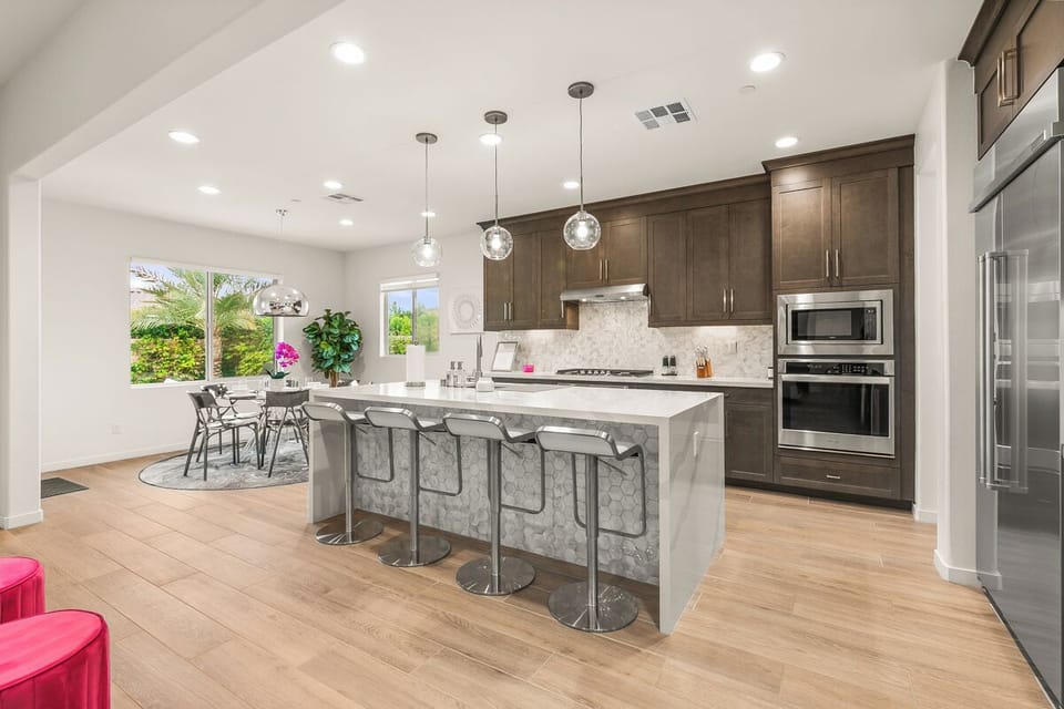 Chef's kitchen with waterfall island, bar seating, and everything you need to cook.