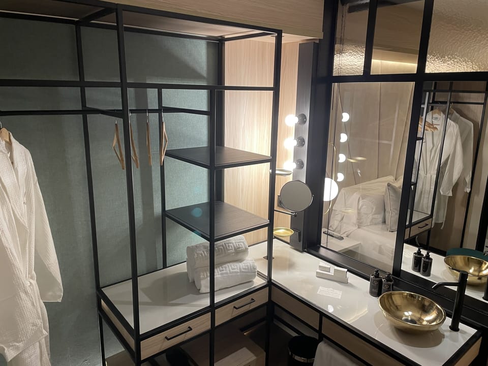 Prepare for the day with bright mirrors and tidy amenities.