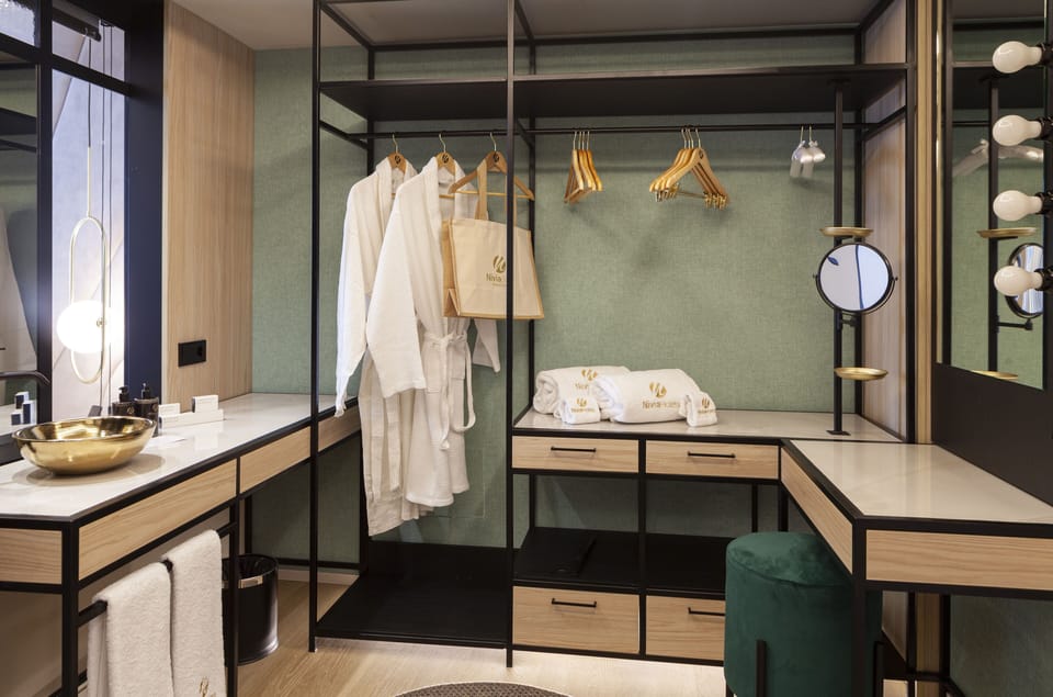 Start your evening glam with a spacious, boutique-style dressing area.