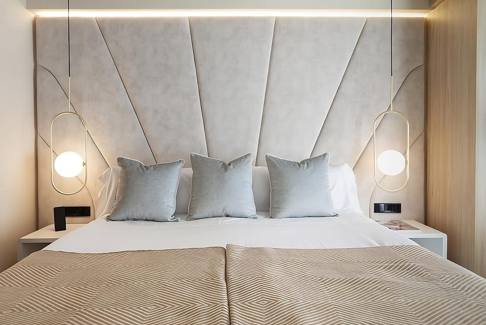 Sink into a serene king bed with designer headboard glow.