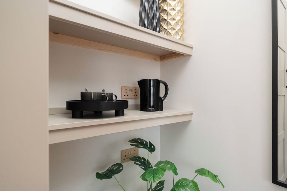 A handy tea, coffee, and sugar station is ready for you to enjoy a warm drink whenever you like.
