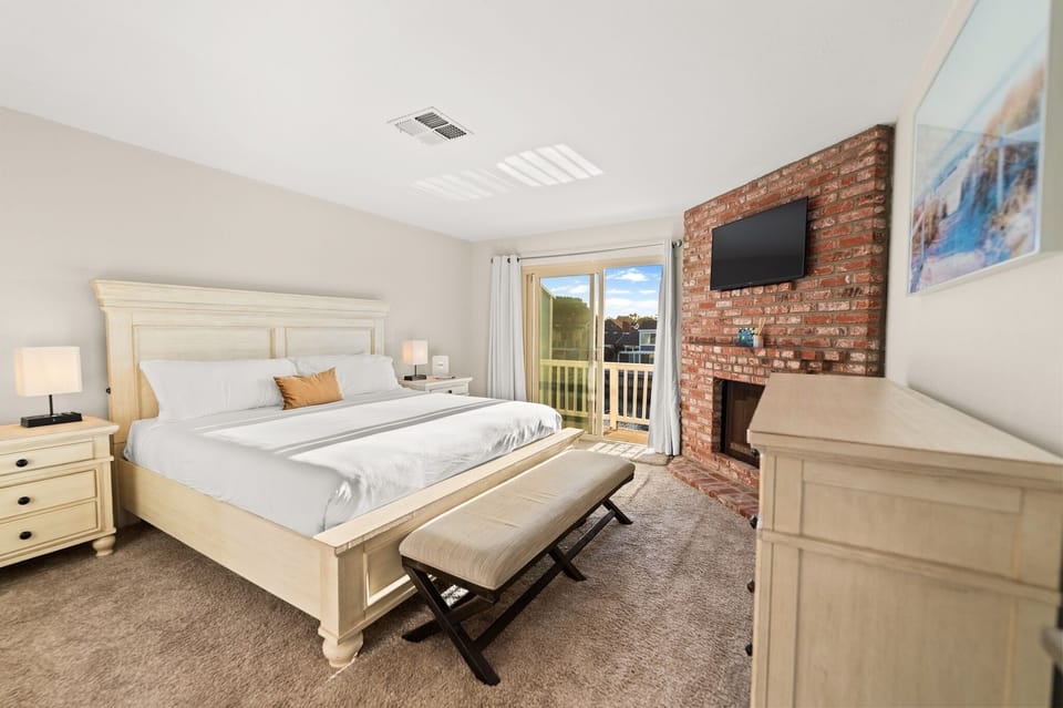 Retreat to a spacious California king suite with private balcony access for the perfect indoor-outdoor escape.