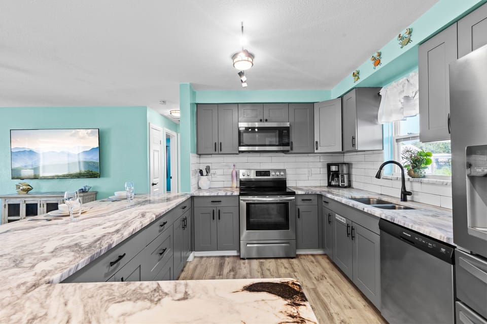 Premium appliances in this newly renovated open-air galley kitchen!