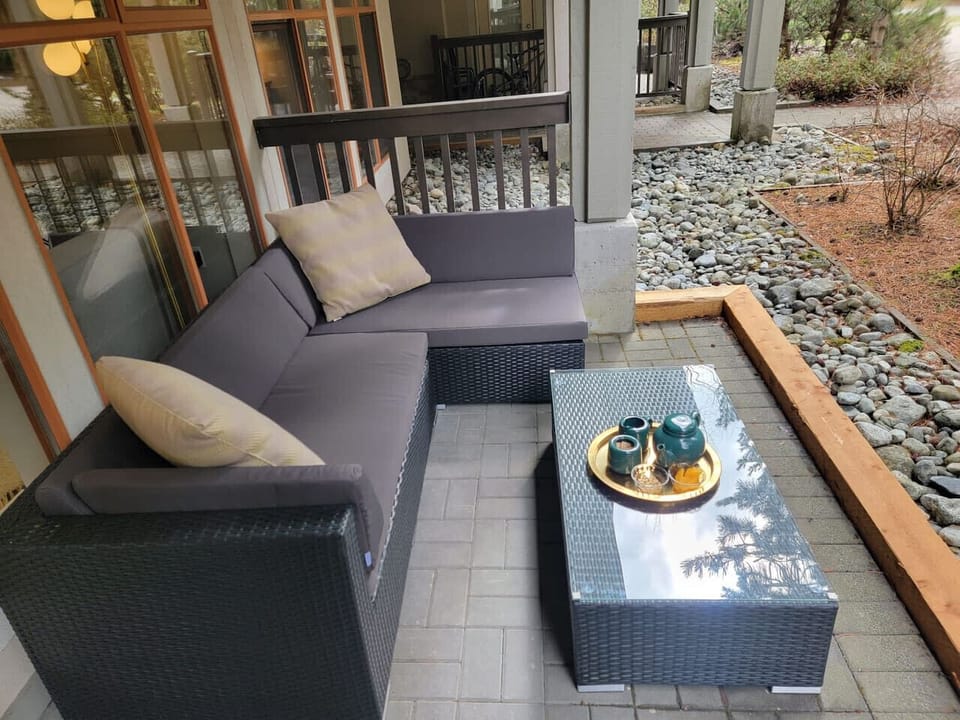 Relish this spacious outdoor terrace area with cushioned seating.