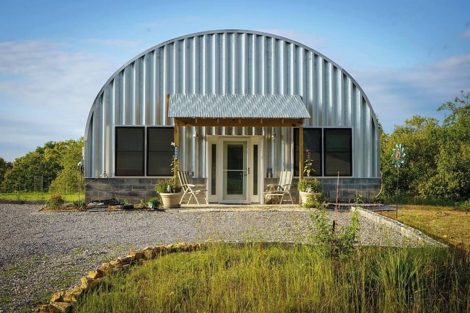 Front parking area. Gravel with cement porch, stabilized gravel in front of door. 