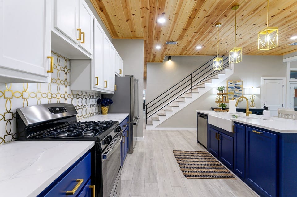 Fully equipped kitchen featuring stainless steel appliances and quartz countertops
