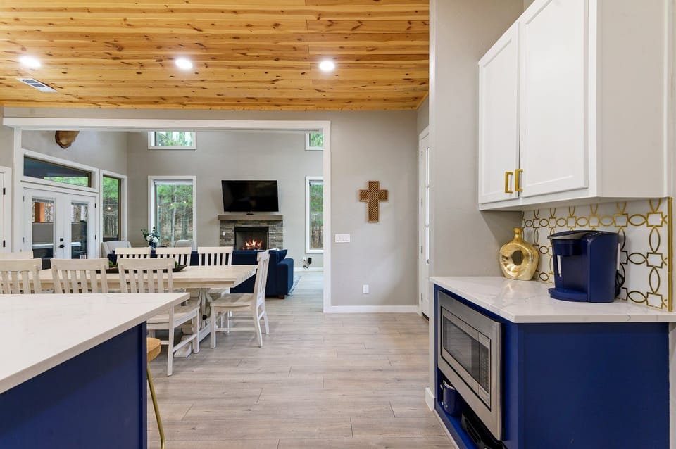 Main level layout featuring open dining, living, and kitchen flow