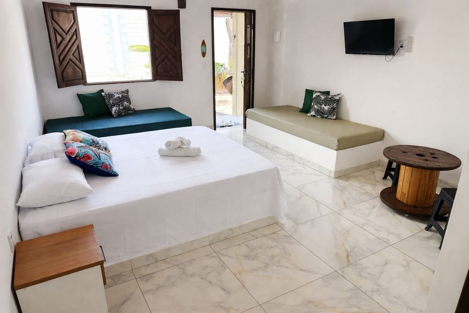 Family Quadruple Room, Garden View | Minibar, individually decorated, iron/ironing board, free WiFi