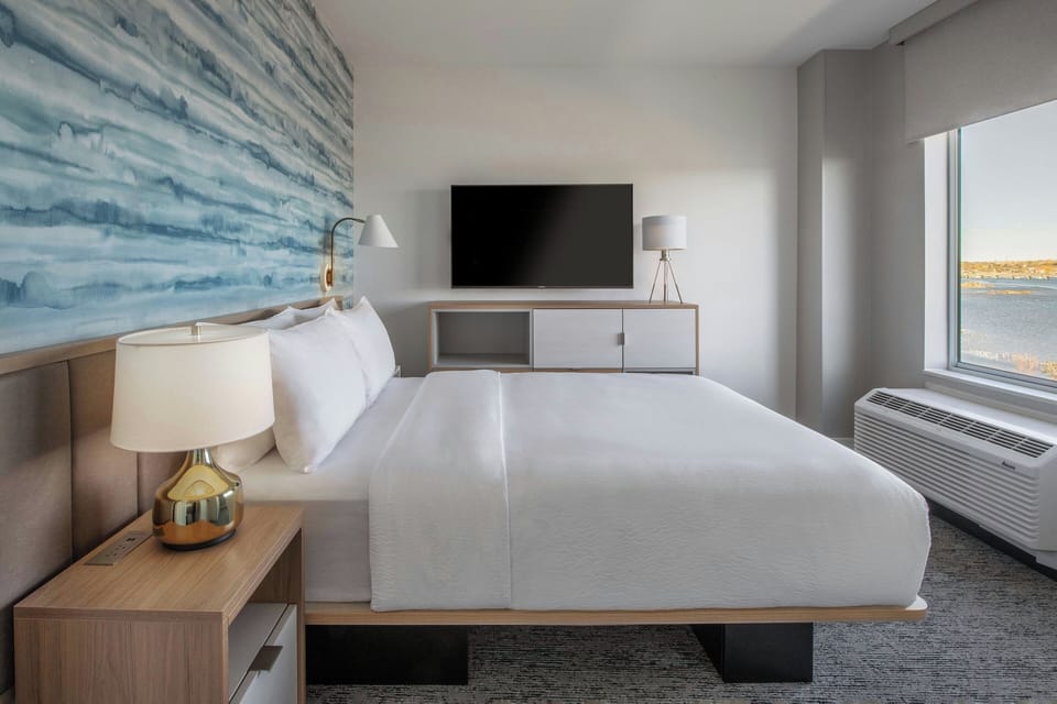 Suite, 1 Bedroom, Balcony, River View | Desk, laptop workspace, iron/ironing board, travel crib