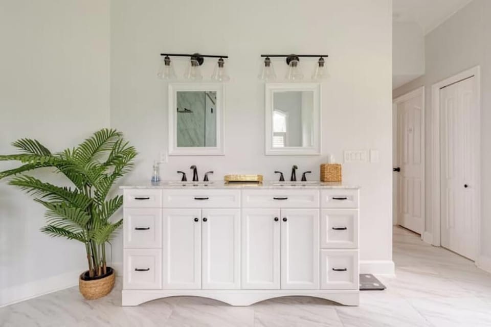 Primary bathroom 1st floor has double sinks, soaking tub and large shower