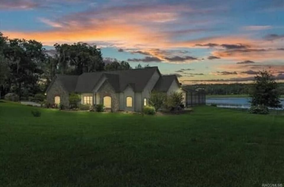 Newly remodeled cozy Cap Cod style home with stunning sunset views over the lake