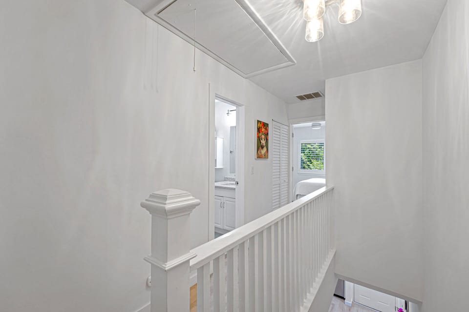 The second-floor landing provides easy access to all upstairs bedrooms and bathrooms, creating a functional layout for families and groups.