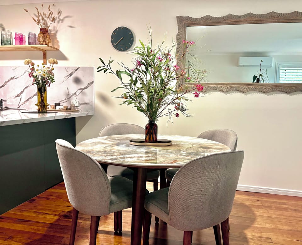 A beautiful ceramic table that is smooth to touch with a unique marble pattern.