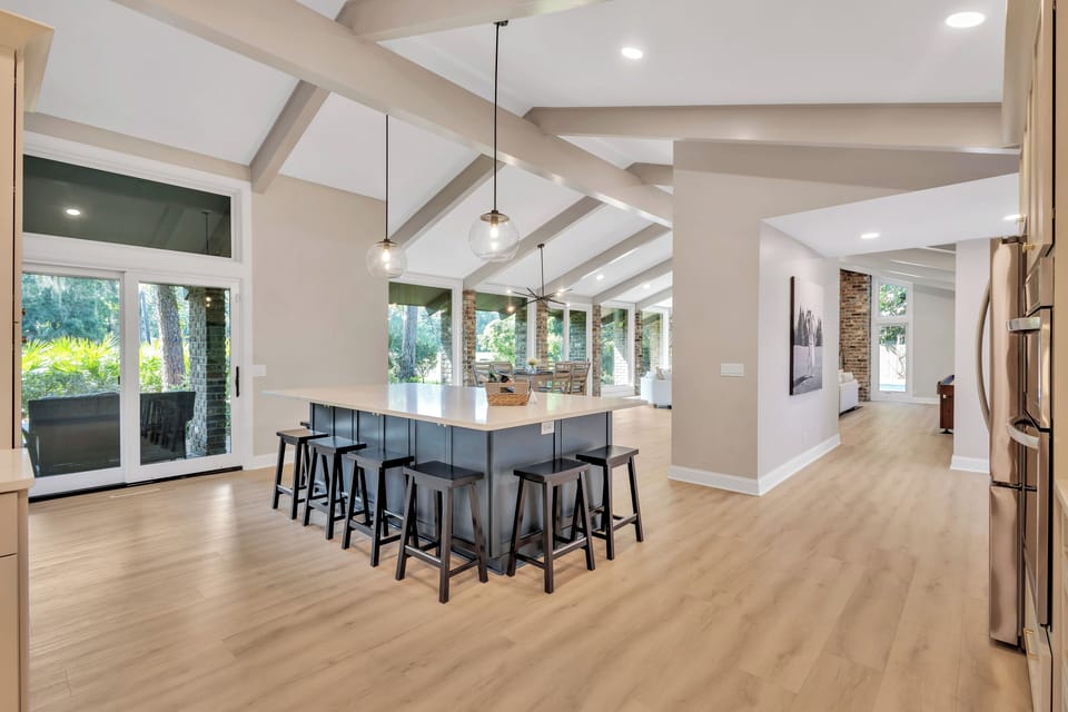 This stunning kitchen boasts views of the fairway and is a dream for culinary delights and gatherings