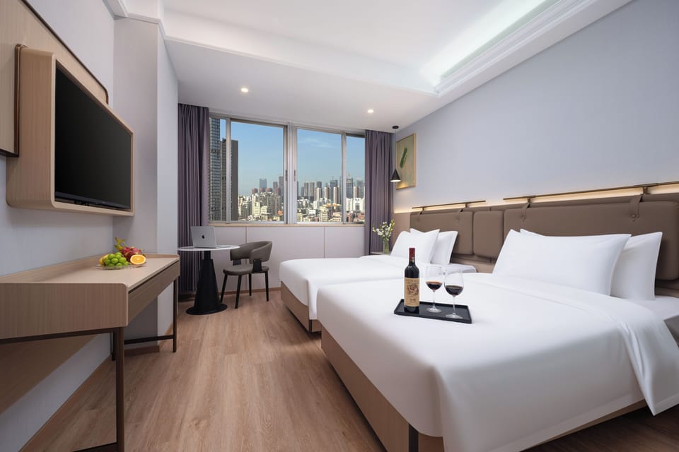 Business Twin Room, City View | Desk, laptop workspace, blackout drapes, soundproofing