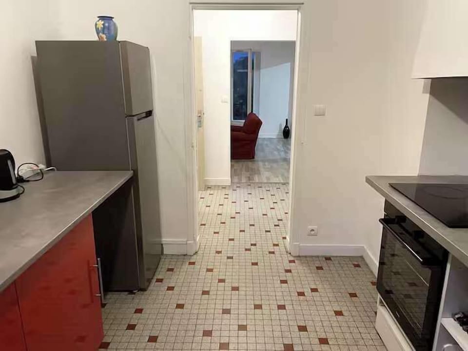 Kitchen with windows and small balcony looking out to car park and Pic du Gar mountains
