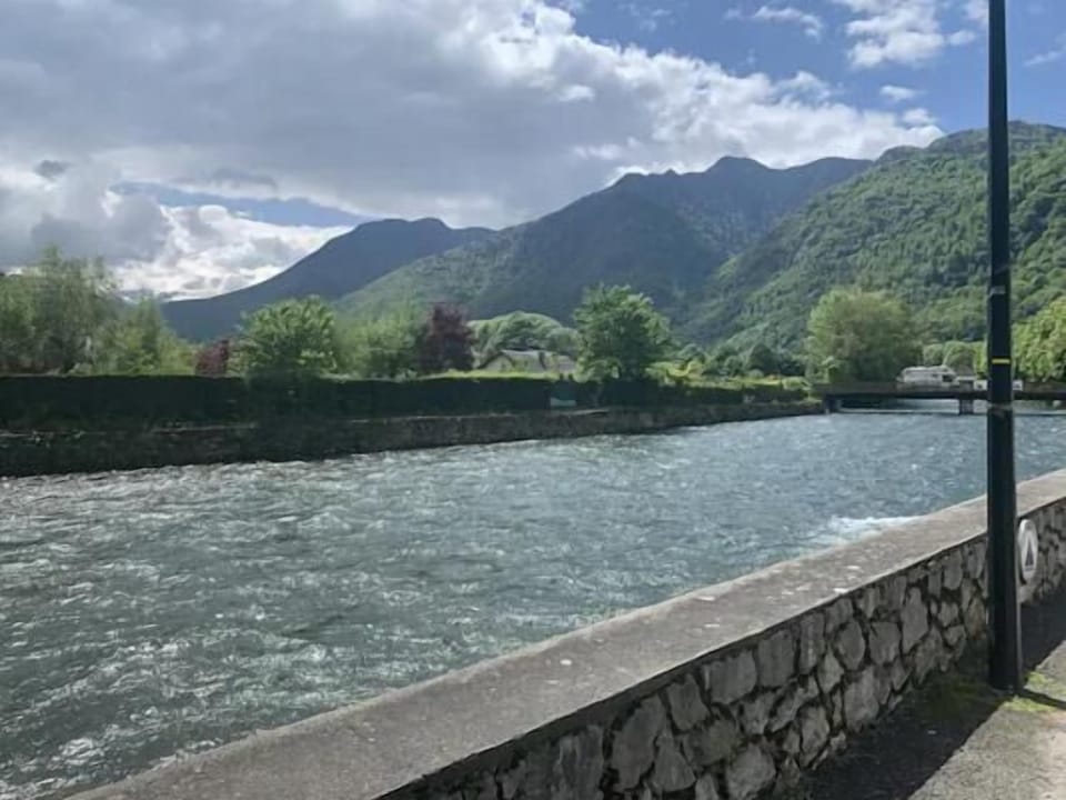 Double bedroom with new double bed and deep mattress, with window views of Pic du Gar mountain