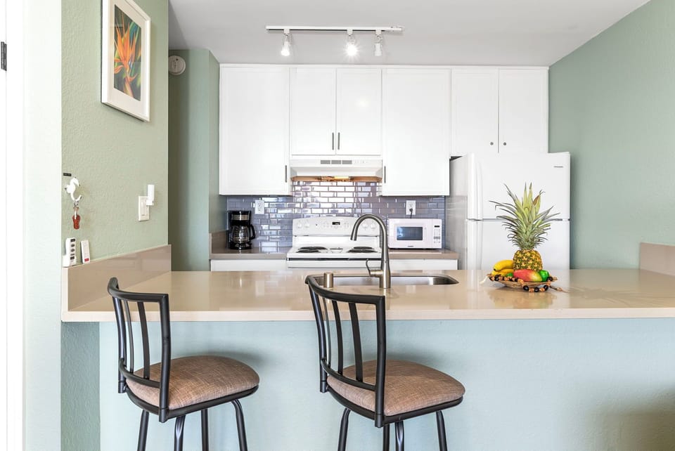 A clean, functional kitchen stocked with full-size appliances, cookware, and everything you need to prepare meals during your stay.