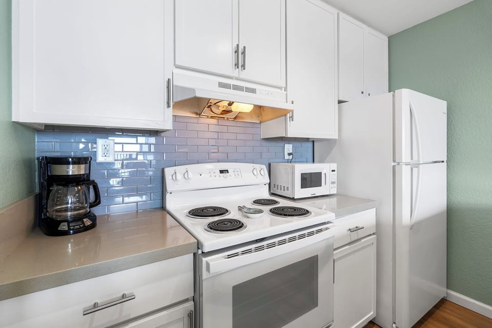 A clean, functional kitchen stocked with full-size appliances, cookware, and everything you need to prepare meals during your stay.