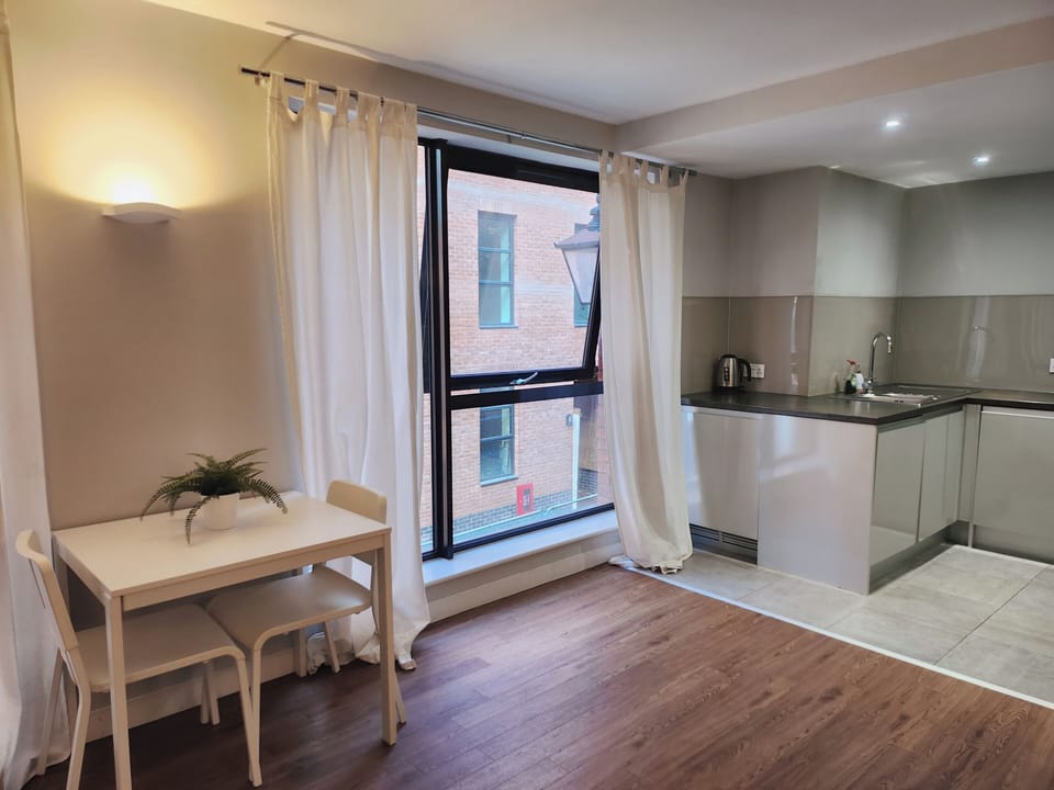 Classic Apartment, Courtyard View | Living area | Flat-screen TV
