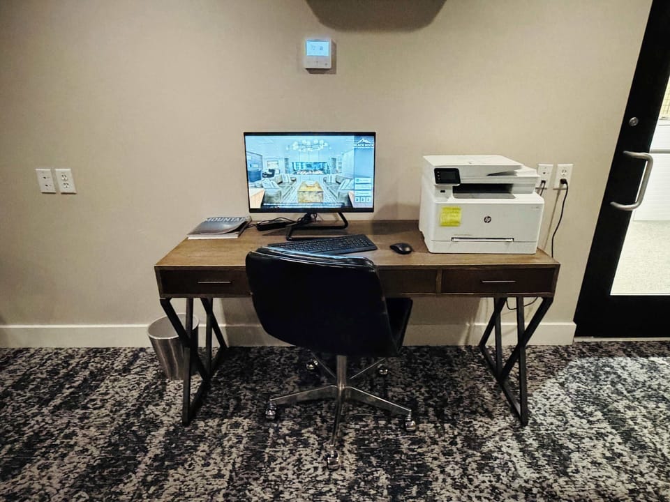 Work station with a printer available next to the ski rental shop