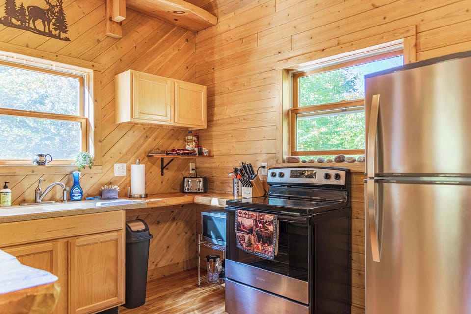Fully equipped kitchen with stainless appliances and gas range, everything you need for home-cooked meals between adventures