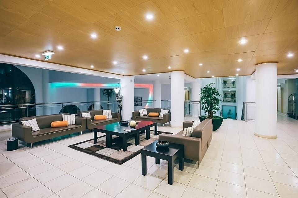 Stretch out on generous seating beneath soft, golden ceiling lights.
