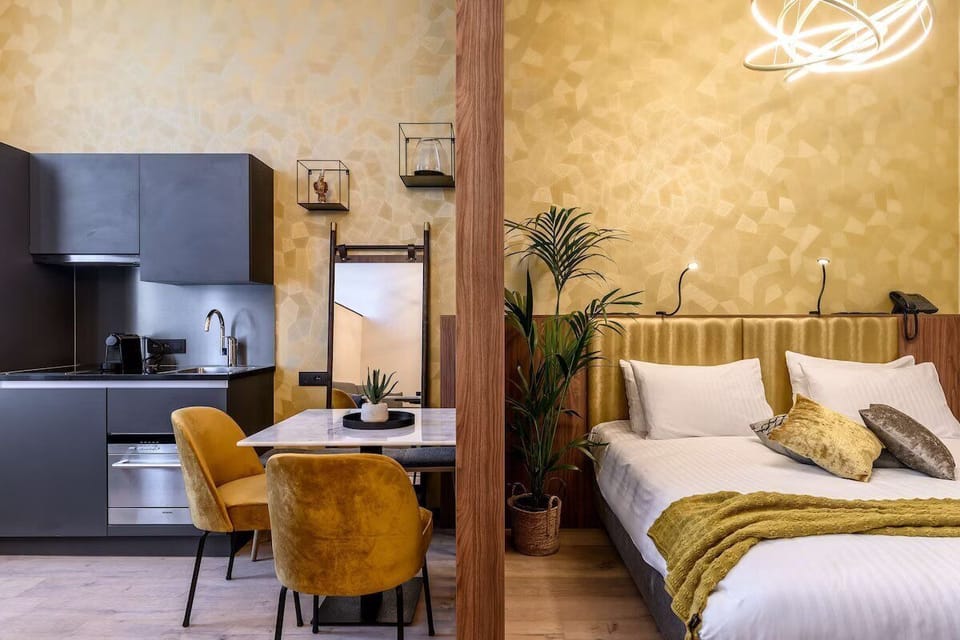 Sink into crisp linens beside sleek design and warm lighting.