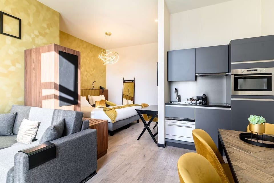 Lounge comfortably in your spacious studio with sofa and kitchenette.