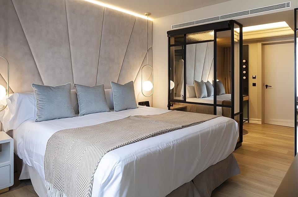 Sink into serene comfort with designer lighting and warm textures.