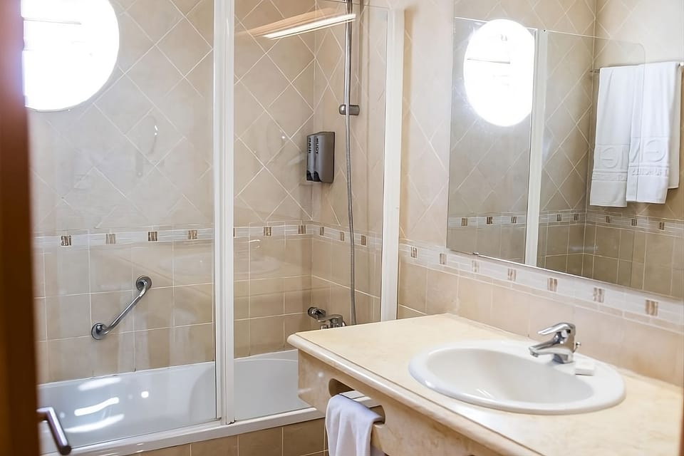 Refresh easily with a bright vanity and shower-bath combo.