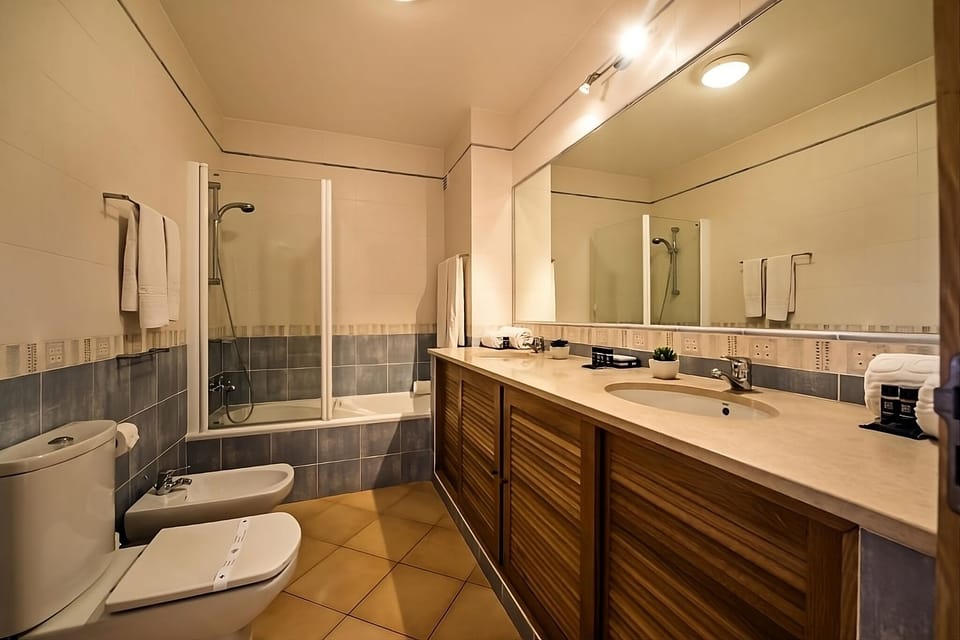 Start your day with plenty of vanity space and bright mirrors.