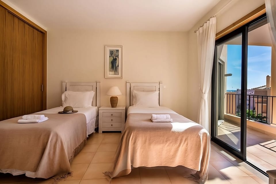 Step onto the balcony and savor morning sun and breeze.