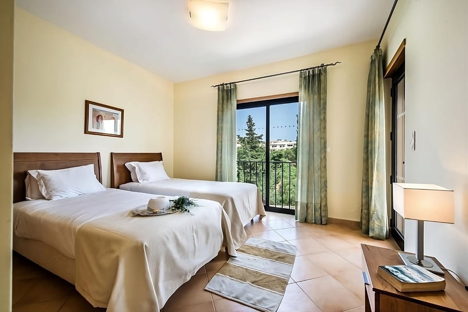 Settle into crisp twin beds beside calming garden views.