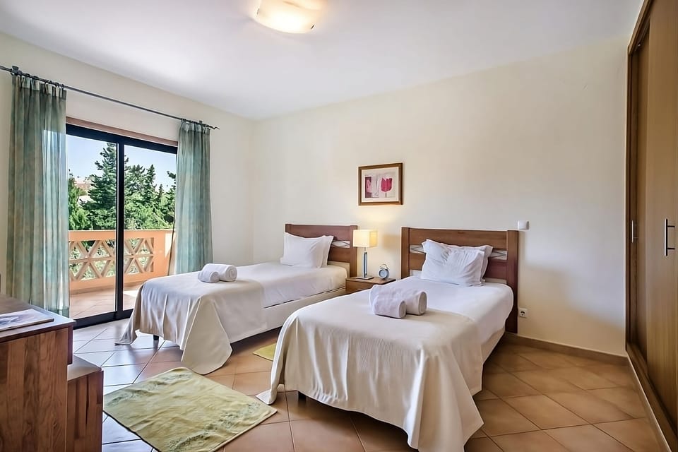 Wake refreshed with easy balcony access and airy natural light.