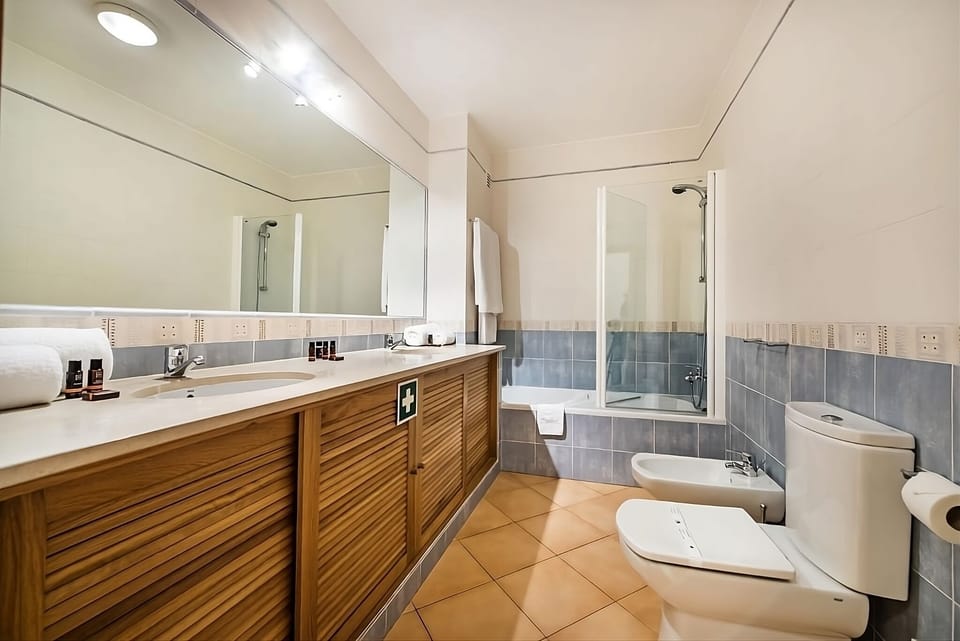 Start the day refreshed in a clean bath with walk-in shower.