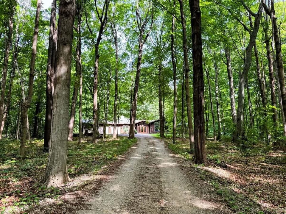 Follow the wooded lane to your private retreat. Peace, quiet, and nature await just minutes from town.