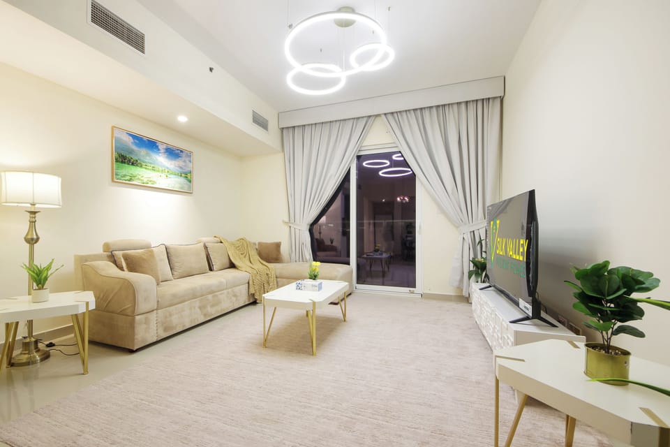 Apartment, River View | Living area | Flat-screen TV